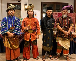 Malay men in busana Melayu, a traditional style of Malay attire