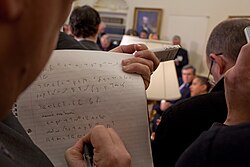 A reporter taking notes at the White House in shorthand, March 2009