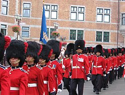 The Royal 22nd Regiment parading in full dress for the 400th anniversary of Quebec City. The Canadian Army's universal full dress includes a scarlet tunic, and midnight blue trousers.