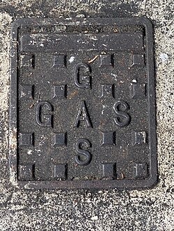 Manhole for domestic gas supply, London, UK