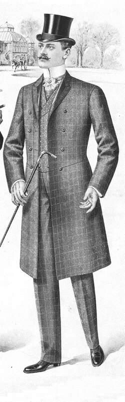 An informal checked frock coat suit with odd waistcoat. The foreparts are connected by a chain link.