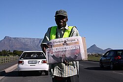 A Cape Town news vendor displays the headline "Zuma Dawn" on 10 May 2009.