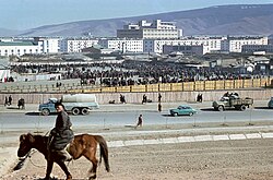 Outdoor market near Gandan Hill in 1972; State Department Store in the background