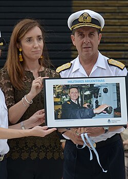 Villarruel and Admiral Julio Horacio Guardia with an image of Eliana Krawczyk