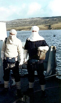 British sailors in anti-flash gear at action stations aboard HMS Cardiff near San Carlos, June 1982