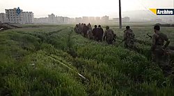 TFSA rebels advance towards a city during the Afrin offensive.