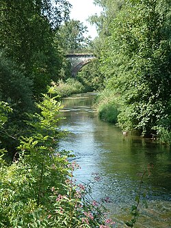 River Rottum in Laupheim with railway bridge in the background