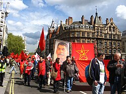 Supporters of the Communist Party of Great Britain (Marxist–Leninist) carrying a banner of Stalin at a May Day march in London, 2008