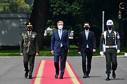 US Ambassador to Indonesia Sung Kim accompanied by local officials at the Presidential Palace wearing face masks amid the COVID-19 pandemic