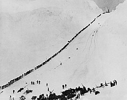 Miners and prospectors climb the Chilkoot Trail during the 1898 Klondike Gold Rush.