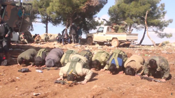 Free Syrian Army fighters praying after capturing Mount Barsa. The conservative values of the Turkish-backed FSA fighters caused tensions with many "leftist-minded" Kurdish civilians.[246]