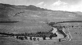 Unpaired fluvial terraces on the South Fork of the Shoshone River, Park County, Wyoming, 1923. The river at left has encountered a formation of erosion-resistant volcanic breccia, causing it to downcut more rapidly on the right, leaving terraces of different elevations.