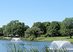 Pond with fountains behind Messick and Lord Halls. Steven Brill reported in 1974 that ETS is known "around Princeton ... for its extravagance."[43]
