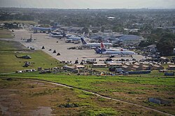 Planes loaded with aid supplies crowd the tarmac at Port-au-Prince airport, waiting to be unloaded, 18 January.