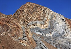 Sevehah Cliff, near Convict Lake, shows severely deformed Devonian rock.[28]