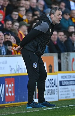 Crosby as Port Vale acting manager in 2022