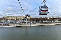 Cable cars passing across the Moskva River and the Luzhniki Stadium