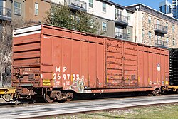 A boxcar with Missouri Pacific reporting marks, repainted with the UP shield logo.