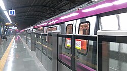 The coaches of the Delhi Metro are color-coded to indicate different service lines.