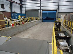 A warehouse in New Jersey, USA, a U.S. East Coast epicenter for logistics and warehouse construction outside Philadelphia, where trucks deliver slabs of granite[1]