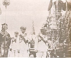 Royal aide-de-camp (centre) in the ceremonial progress for the royal funeral of King Ananda Mahidol of Thailand in March 1950