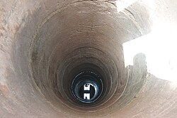 View into a hand-dug well cased with concrete rings. Ouelessebougou, Mali.
