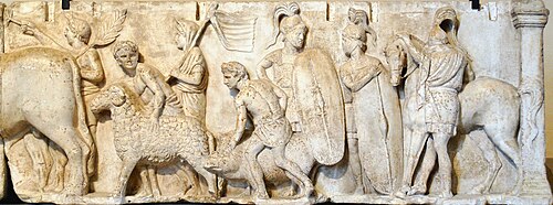 Detail from the Ahenobarbus relief showing (centre-right) two Roman foot-soldiers c. 122 BC. Depicted are Montefortino-style helmets with horsehair plume, chain mail cuirasses with shoulder reinforcement, oval shields with calfskin covers, gladius and pilum.