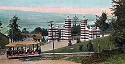 A 1907 illustration of a streetcar passing Eddy Gate, the main entrance to Cornell University at the time