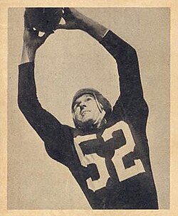 Harry Gilmer catching a football.