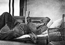 Stalin reading a newspaper, 1920