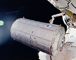 The Destiny module being installed on the ISS