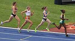 Muir (second from the right) races in the 800 m heat of the Birmingham Commonwealth Games.