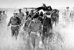 King Hussein on 21 March 1968 checking an abandoned Israeli tank in the aftermath of the Battle of Karameh