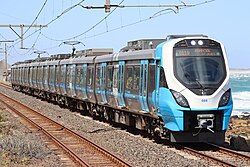 A Metrorail train pulling out to Fish Hoek station in Cape Town
