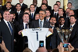 U.S. President Barack Obama presented with a team jersey during an event to welcome 2014 MLS Cup champions the LA Galaxy in the East Room of the White House on February 2, 2015