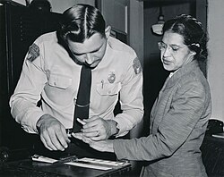 Rosa Parks being fingerprinted after being arrested for not giving up her seat on a bus for a white passenger to sit in the otherwise-empty row