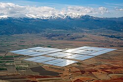 The 150 MW Andasol solar power station is a commercial parabolic trough solar thermal power plant, located in Spain. The Andasol plant uses tanks of molten salt to store solar energy so that it can continue generating electricity for 7.5 hours after the sun has stopped shining.[56]