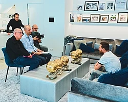 Messi (right) being interviewed in 2019 by France Football. Messi's success on the pitch has earned him widespread recognition and popularity.