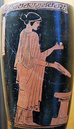 Woman pouring a libation on an altar