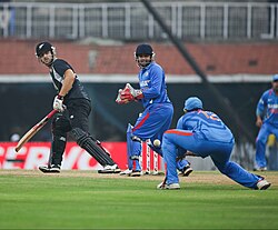 Chennai hosted an ODI match between India and New Zealand in 2010. The New Zealand batsman is in black, and India in blue are the fielding team.