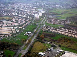 Aerial view of the post-1930s A82 Great Western Road as a municipal boundary: Drumry (West Dunbartonshire) lies to the south / left of image, Drumchapel (Glasgow City) to the north / right