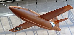 X-1-1 #46-062 Glamorous Glennis at the National Air and Space Museum. Its color is international orange.[39]