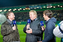 Steffen Freund and Horst Hrubesch in discussion on Eurosport at the under-21 football international between England and Germany in 2017.
