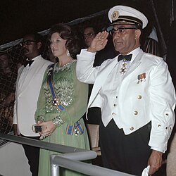 Prime Minister Henck Arron, future queen Beatrix of the Netherlands and President Johan Ferrier on 25 November 1975