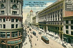 Market Street, pictured on a postcard, c. 1900. At the near left, the Flood Building at Powell Street. The Emporium is to the right.