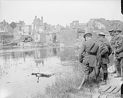 King George V visiting the ruins of Peronne, 13 July 1917. With him are Lieutenant-General William Pulteney, GOC III Corps, and Brigadier-General Percy Hambro, the Quartermaster General of III Corps.