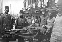 Men transporting a wounded Ottoman soldier at Sirkeci