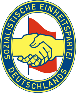 SED logotype: the Communist–Social Democrat handshake of Wilhelm Pieck and Otto Grotewohl, establishing the SED in 1946
