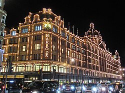 Harrods illuminated exterior at night in Knightsbridge, London