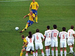Sweden's Henrik Larsson taking a free kick against the Netherlands in the UEFA Euro 2004 quarter-finals